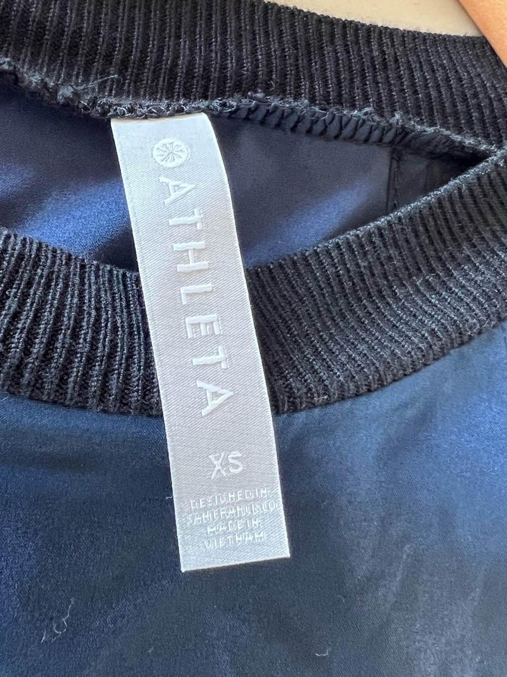 Athleta Navy “silky feel” Top with Black Ribbed Collar